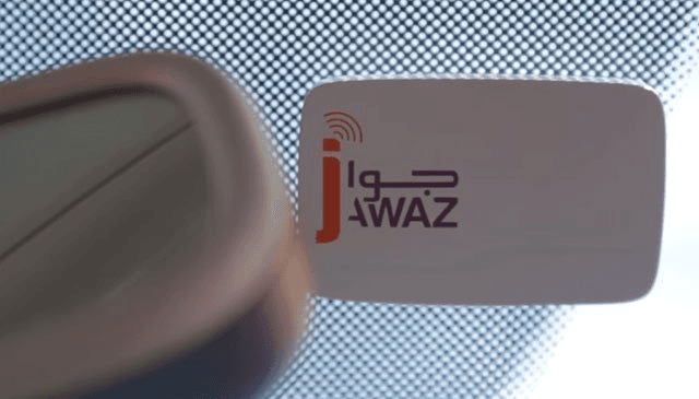 Jawaz badge affixed to the windshield near the rear-view mirror